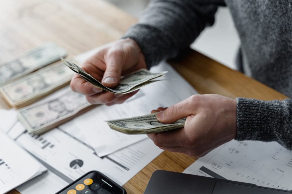 close up shot of a person holding paper money